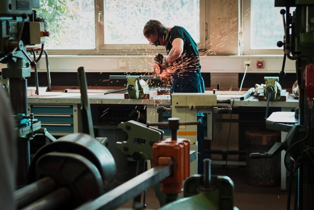 Technician performing precision welding at Accurate Edge facility